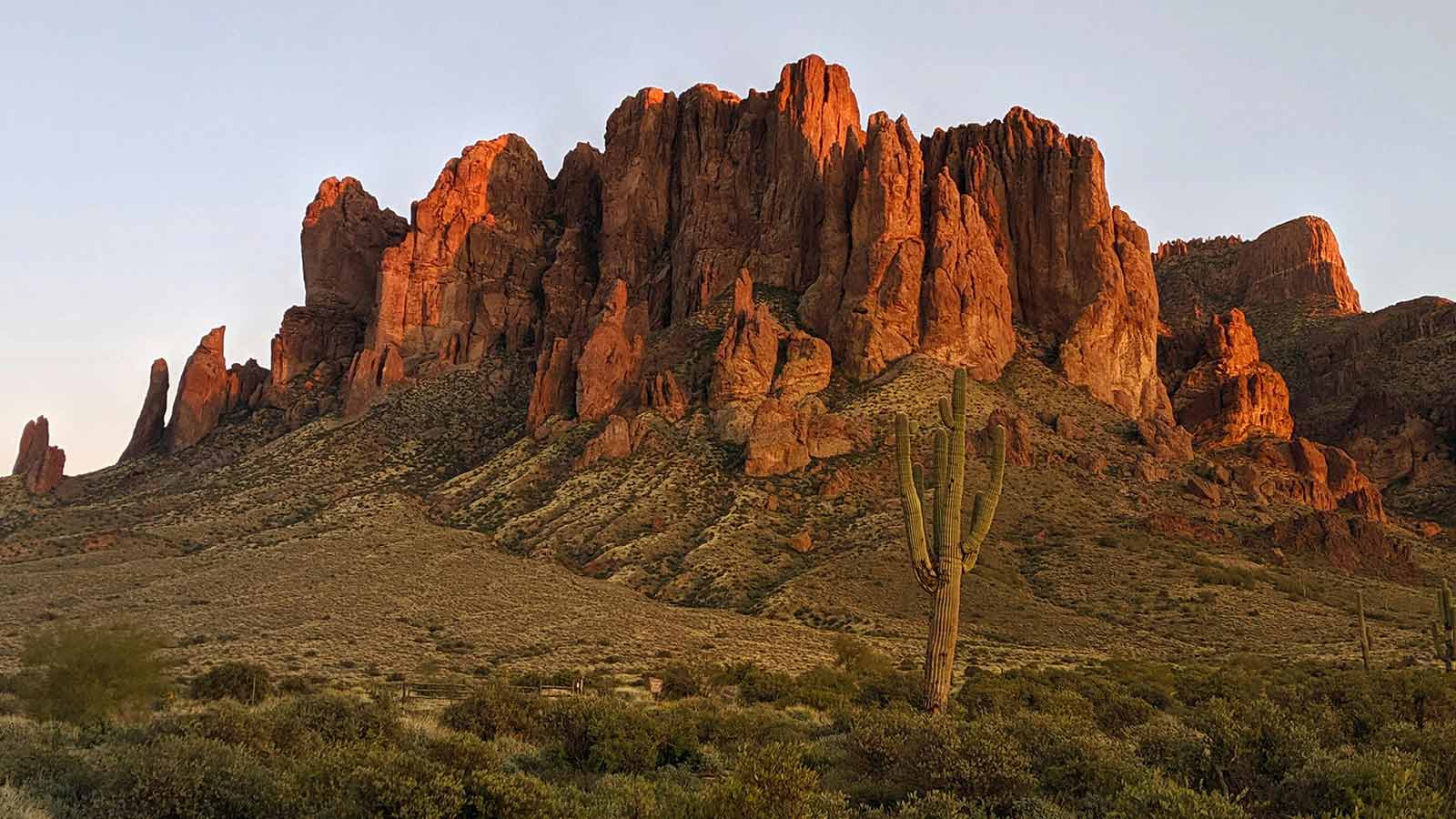 Sunlit desert mountains and a saguaro cactus outside Phoenix, Arizona, in Maricopa County
