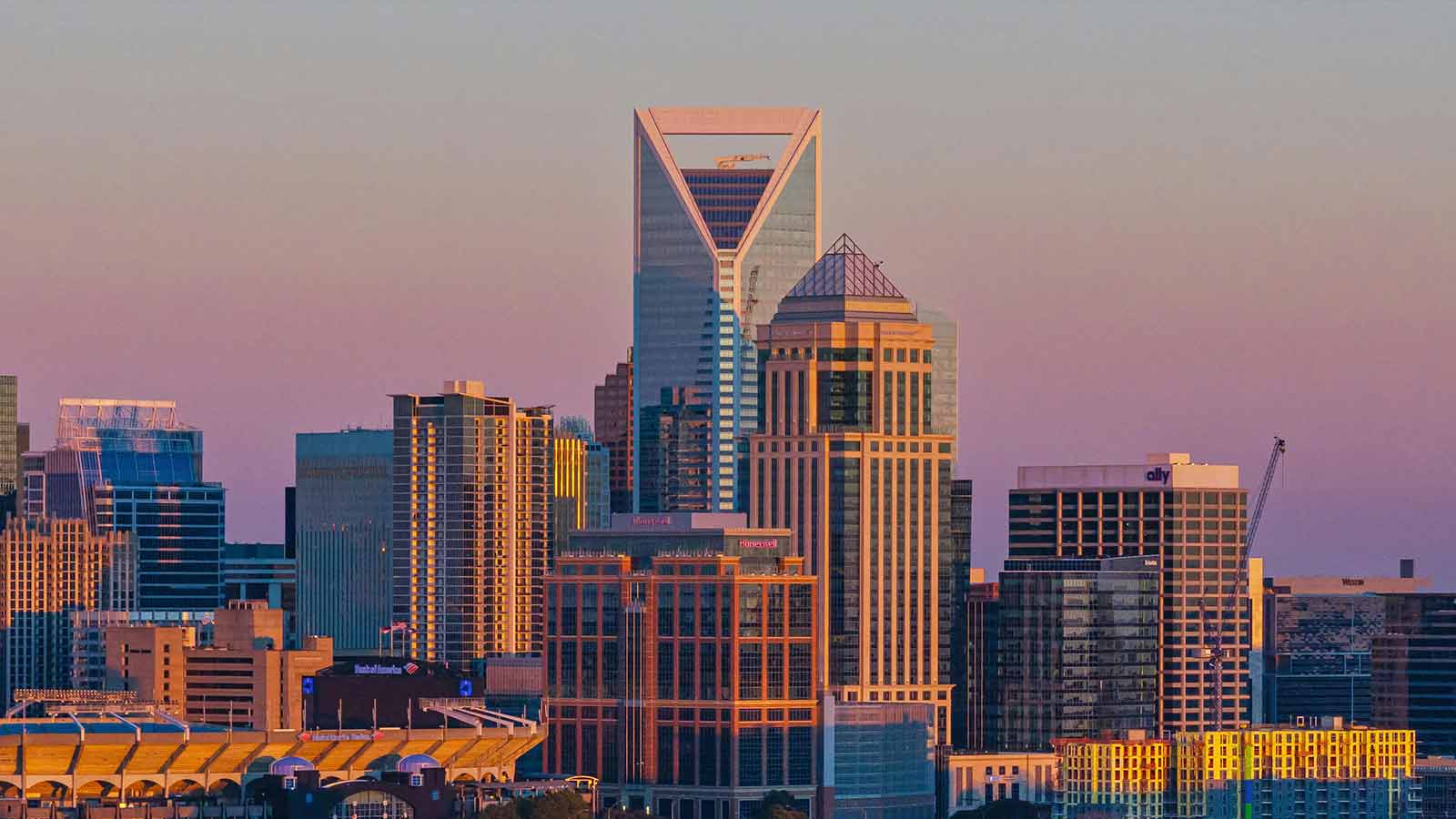 a city skyline with many tall buildings title search in North Carolina how to find liens on property