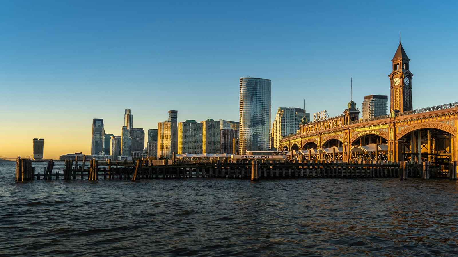 a bridge over water with a city in the background warranty deed title search in new jersey