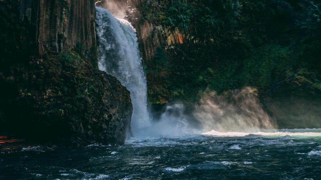 title examiner title abstractor title search real estate title insurance companies record documentation issuing title attention to detail image of a waterfall in oregon