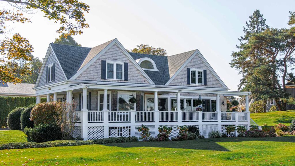a house with a porch and a lawn with Sidney Lanier Cottage in the background example of How to Find Liens and Title Search in Texas