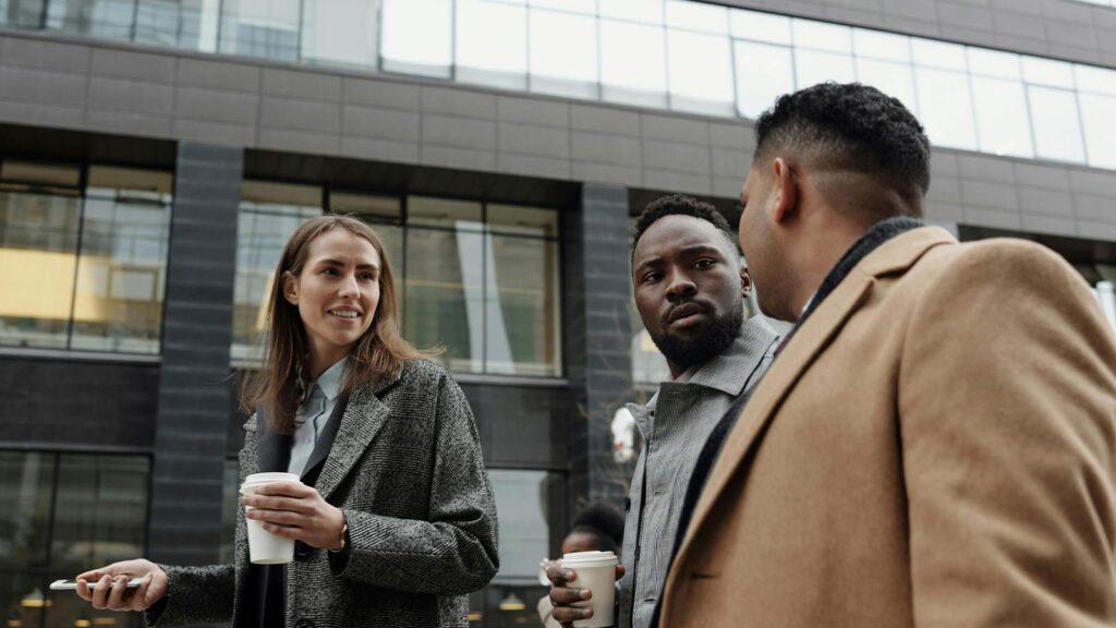 a group of people standing outside a building Title Search in Minnesota