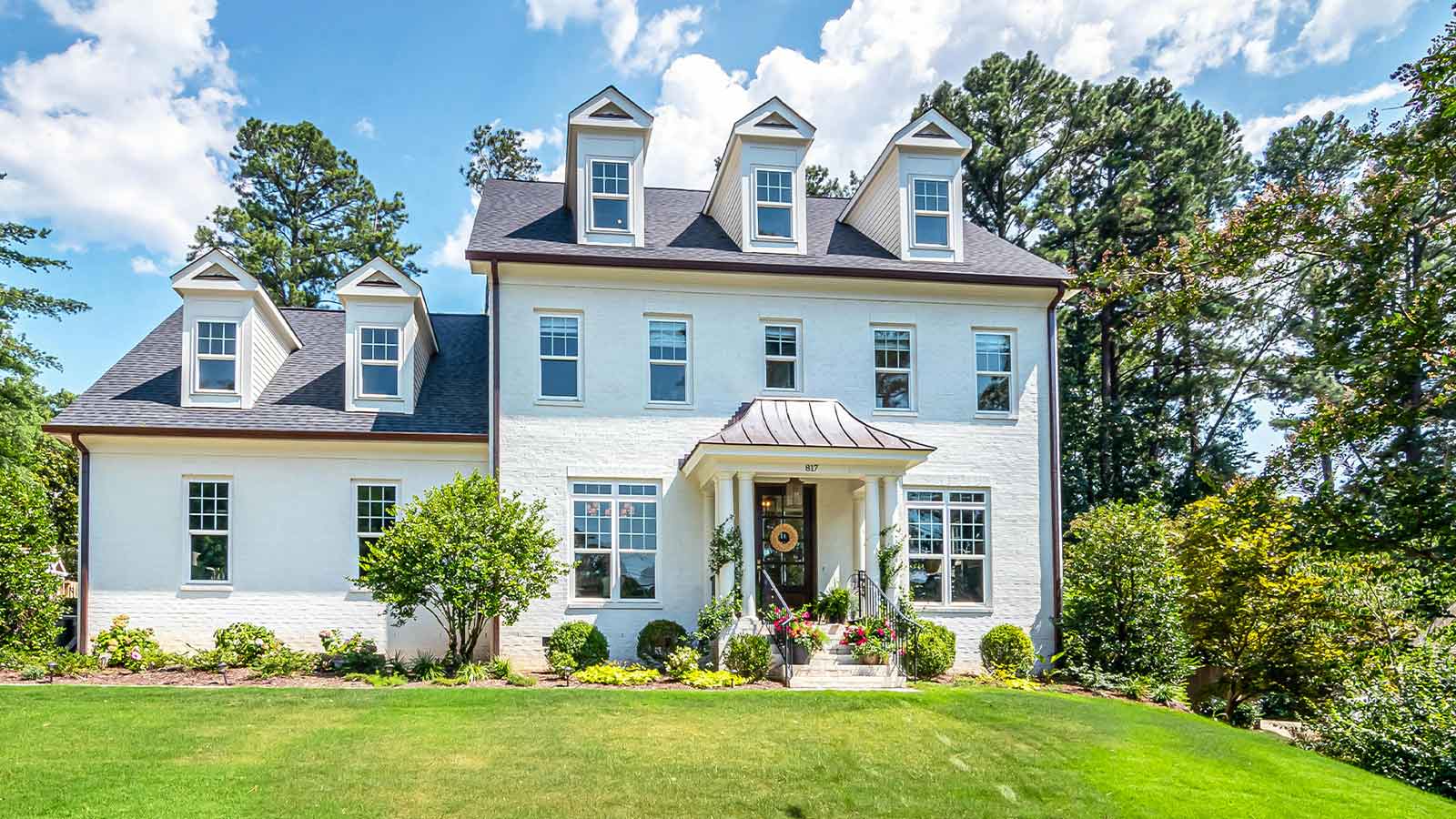 a white house with a lawn and trees New Hampshire Title Search: Fast, Accurate Reports from AFX