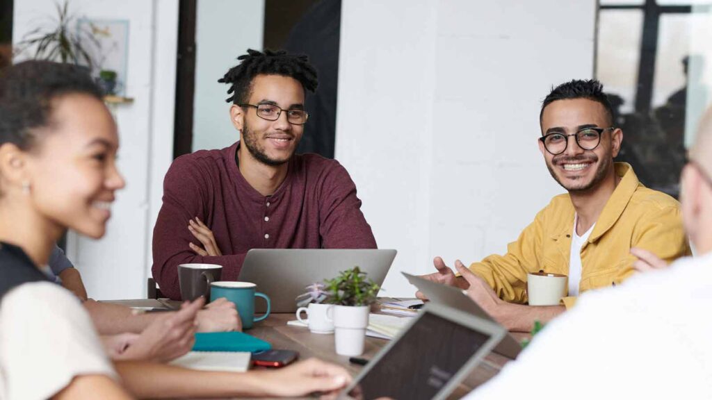 a group of men sitting around a table due diligence