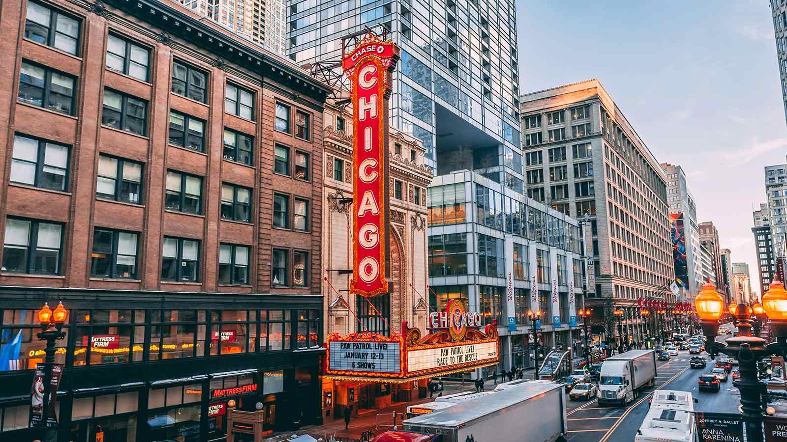 a large sign on a street with buildings and cars Title Search in Illinois