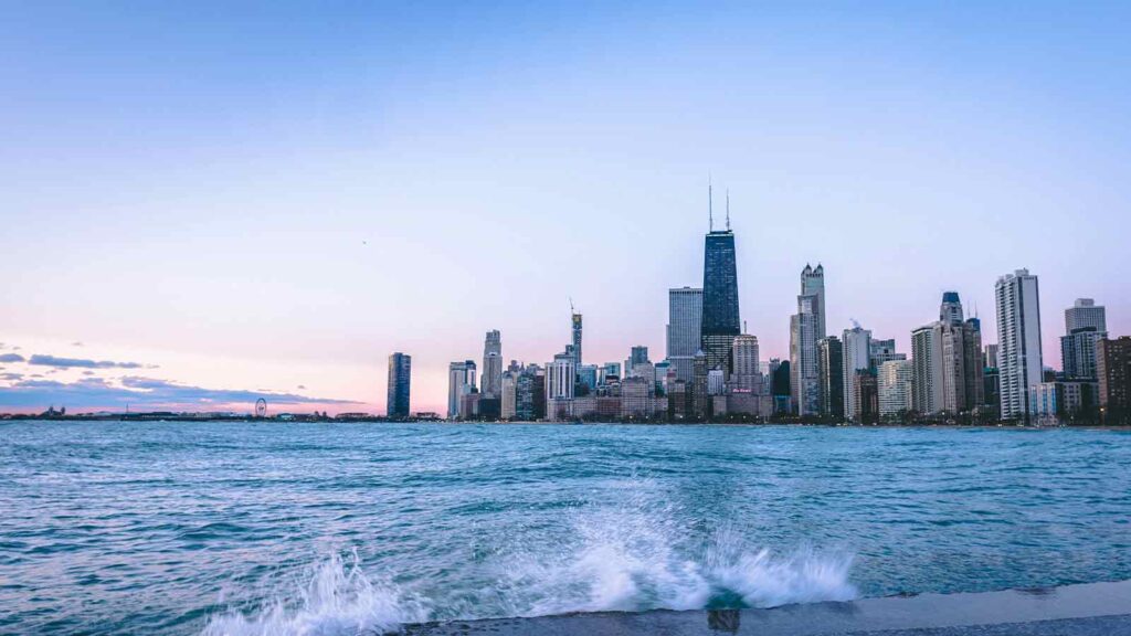 a city skyline with water splashing Title Search in Illinois