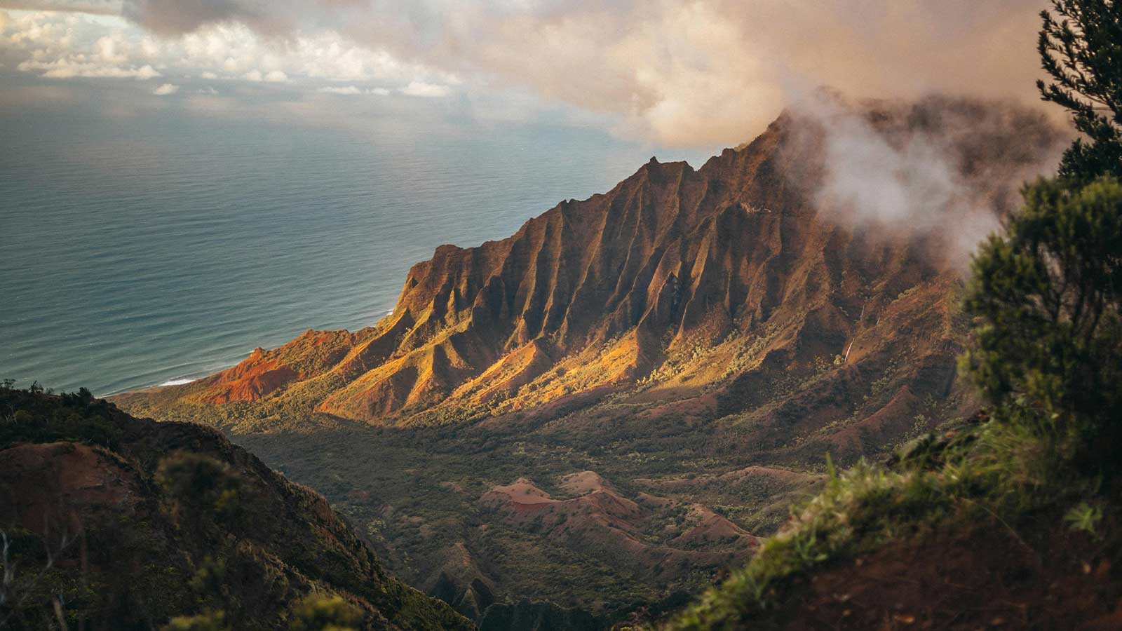 a mountain with clouds and water hawaii title search