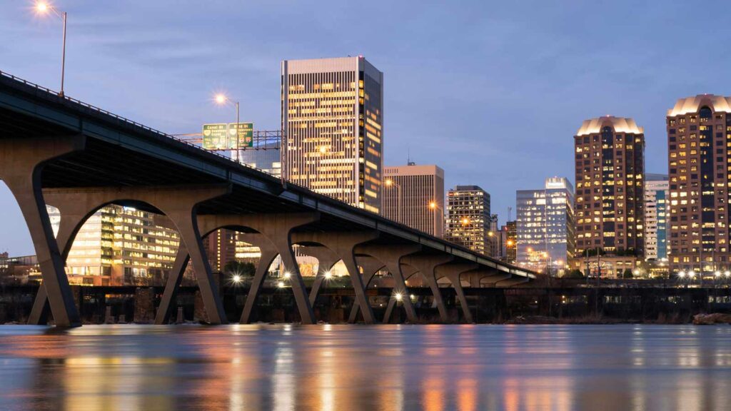 a bridge over a body of water with buildings in the background Virginia Property Title Search