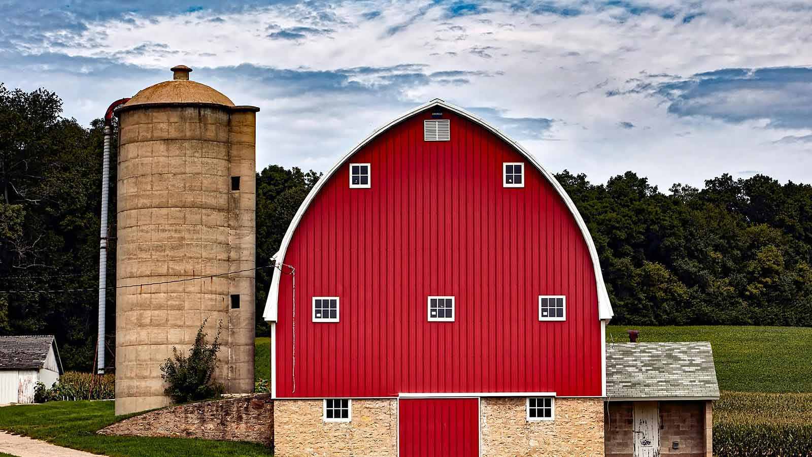 a red barn with a silo in the background West Virginia Title Searches & Deeds