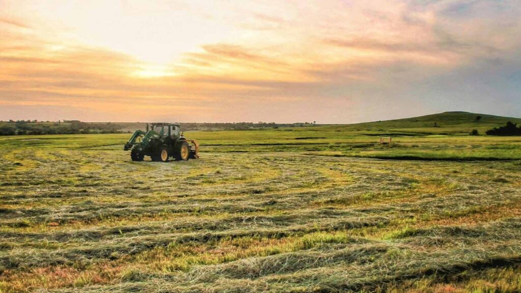 a tractor in a field Kansas title search