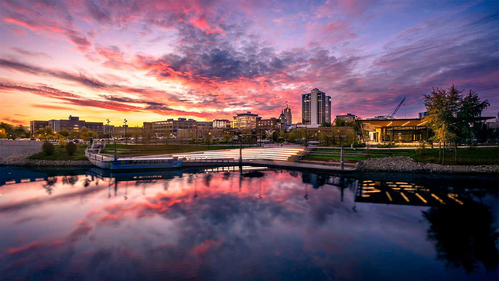a city skyline with a body of water Indiana Title Search