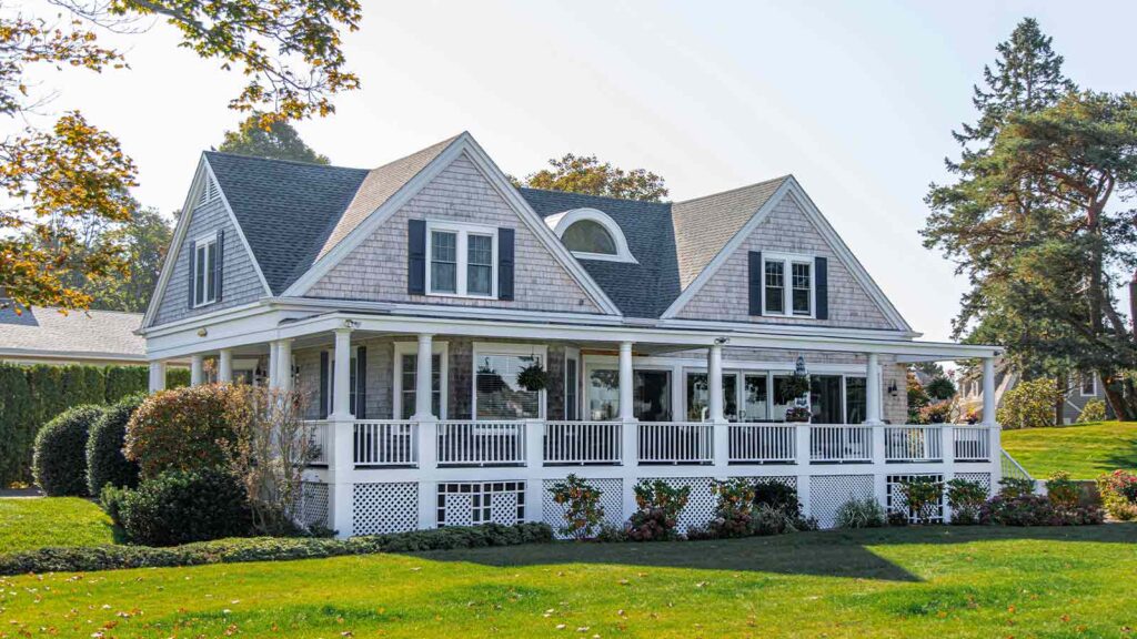a house with a porch and a lawn with Sidney Lanier Cottage in the background Nationwide Title Search Solutions for Every Industry: AFX Research Leads the Way