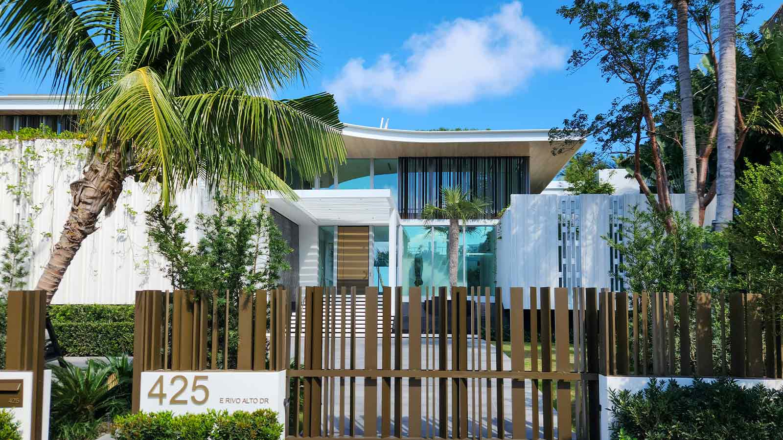Modern house with lush landscaping Lien Search