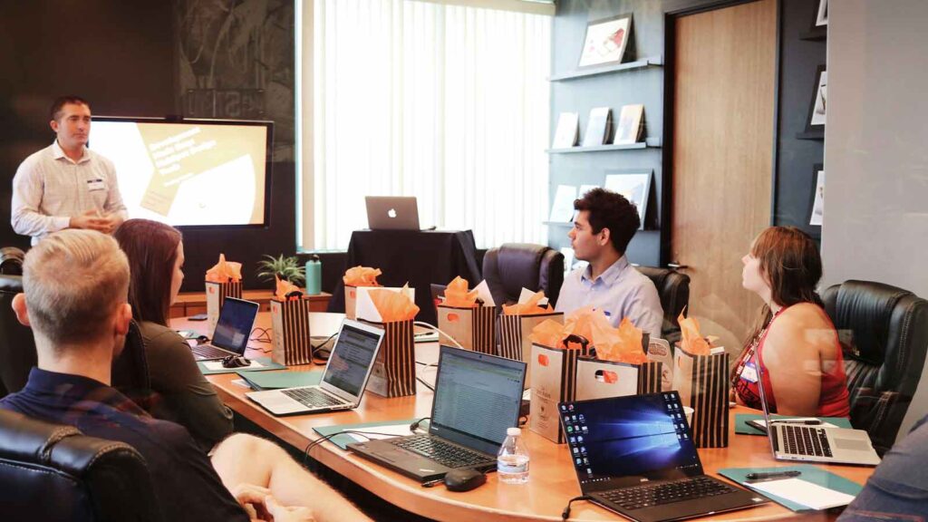 Business meeting with laptops and presentations. AUL