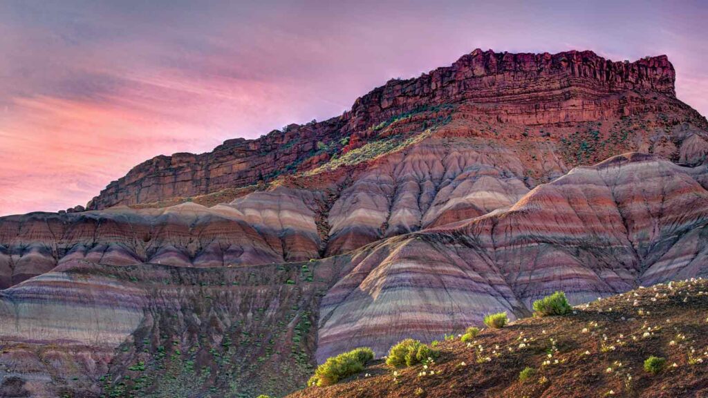 Colorful layered rock formations at sunset AI Title Search in Utah
